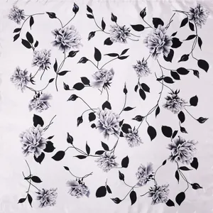 Detail view of elegant black and white floral pattern on a 90cm silk-like square scarf