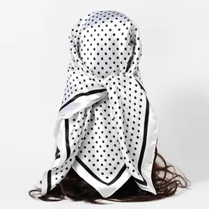 Back view of 90cm white satin square scarf with black polka dots worn as a bandana