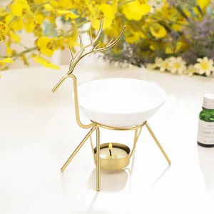 Quemador de aromaterapia de hierro de ciervo dorado con plato de cerámica blanca decoración