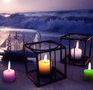 Minimalist black metal geometric candle holder with colorful candles for home decor and parties