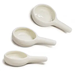 Detail view of white ceramic handle tray for aromatherapy candle burner and teapot warmer.