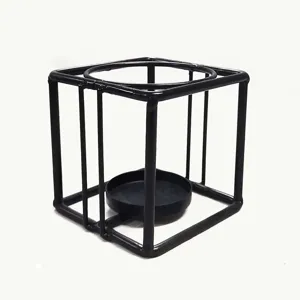 Black metal geometric candle holder, modern minimalist wire lantern stand for home decor.