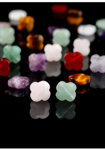 Detailed view of colorful four-leaf clover natural stone beads for DIY jewelry making