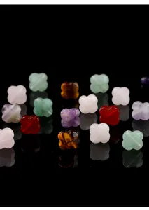 Macro detail of various natural stone clover beads including tiger eye for DIY jewelry