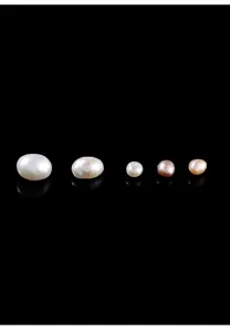 Detailed view of natural freshwater rice pearls in white, pink, and lavender colors