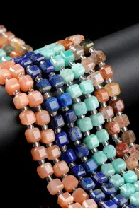 Close-up macro of colorful natural stone cube beads for handmade DIY jewelry making