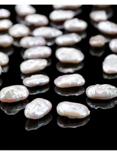 Macro view of natural white Baroque pearl nuggets with high luster for DIY jewelry design
