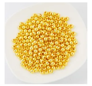 Detailed view of 18K gold plated copper round spacer beads for DIY jewelry making