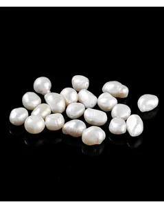 Detailed macro shot of irregular white natural freshwater pearl beads for jewelry making