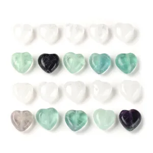 A collection of heart-shaped natural stone crystal beads in white green and purple
