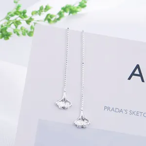 Elegant long drop earrings featuring silver ginkgo leaf charms on box chains.