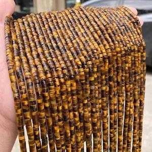 Close-up of 4x2mm natural Tiger Eye stone disc beads for DIY jewelry making