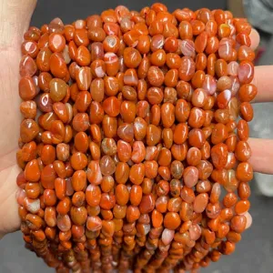 Close-up of irregular natural red agate nugget beads for DIY jewelry making