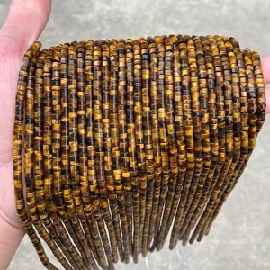 Close-up of 4x2mm natural yellow tiger eye disk beads for jewelry making