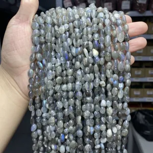 Close-up of 6-8mm natural labradorite pebble beads showing unique blue flashes and fire