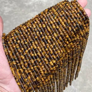 Macro detail showing natural yellow tiger's eye disk beads 4x2mm for jewelry making