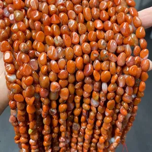 Macro detail of irregular natural carnelian agate stone beads for DIY jewelry making