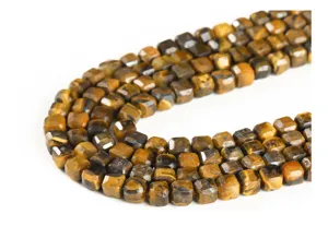 Macro detail of natural yellow tiger eye faceted cube beads for jewelry making