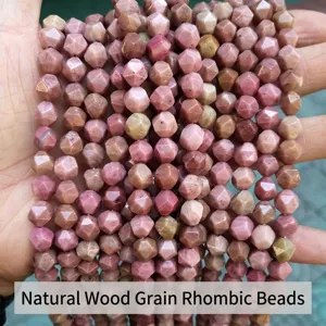 Detailed macro view of faceted pink rhombus stone beads for jewelry making