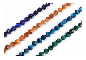 Close-up of faceted diamond-shaped tiger's eye beads in various colors for DIY jewelry.