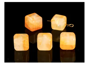 Detailed macro shot of natural yellow crackle quartz cube beads for DIY jewelry