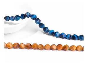 Close-up of faceted rhombus Tiger Eye beads showing natural blue and brown stone texture