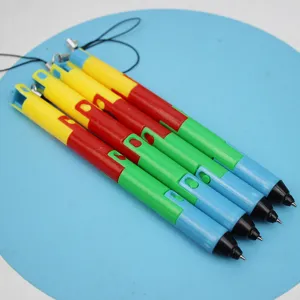 Close-up detail of four colorful creative folding plastic ballpoint pens with hanging cords