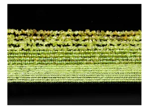 Close-up view of natural peridot beads strands showing crushed and faceted textures for jewelry DIY