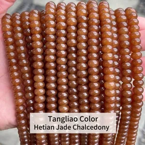Close-up macro view of brownish-orange chalcedony abacus beads for DIY jewelry making