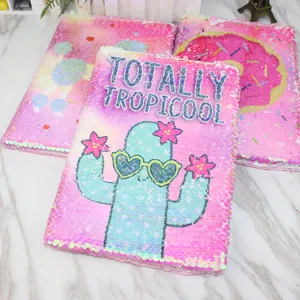 Reversible sequin notebook with cute cactus and sparkling cover for daily writing goals.