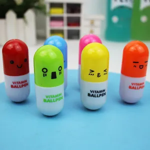 Close-up detail of cute cartoon pill-shaped retractable ballpoint pens in multi colors