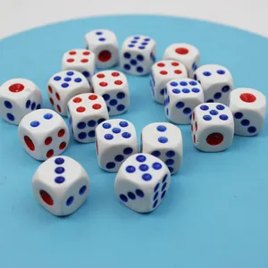 Close up detail of multiple white dice with red and blue dots for board games and entertainment.