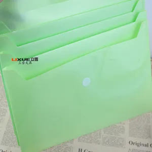 Close up of light green multi-layer plastic accordion folder, perfect for organizing files.