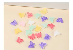 Detailed view of 12mm colorful transparent butterfly glass beads for DIY crafts