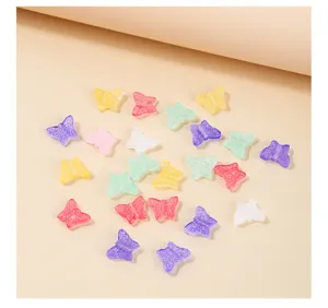 Detailed view of 12mm multi-colored translucent glass butterfly beads for DIY jewelry