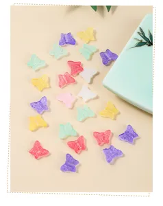 Detail view of colorful translucent butterfly glass beads for DIY jewelry making