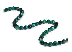 Macro view showing the detailed facets of green tiger eye diamond beads for DIY jewelry