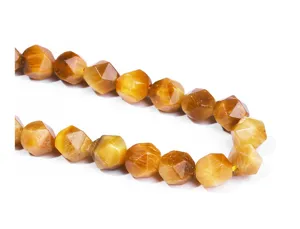 Close-up macro detail of natural faceted tiger eye gemstone beads for DIY jewelry design