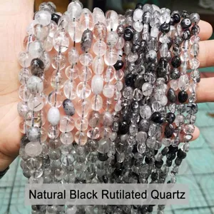 Close-up of natural black rutilated quartz irregular stone beads for DIY jewelry making