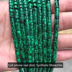 Macro detail of 2x4mm green synthetic malachite column beads for DIY jewelry