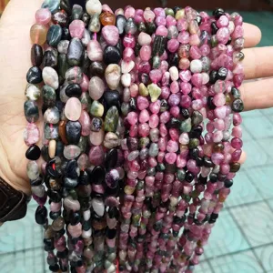 Close-up of multi-colored irregular natural tourmaline crystal chip beads for DIY jewelry