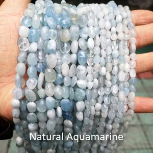 Close-up of light blue irregular natural aquamarine gravel beads for DIY jewelry