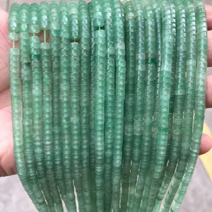 Close-up of 2x4mm natural green aventurine stone disc beads for DIY jewelry making