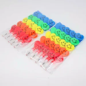 Detailed view of colorful heart smiley face non-sharpening stackable pencils in clear packs.