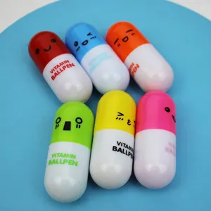 Creative pill-shaped ballpoint pens with cute smiley faces and telescopic design for students