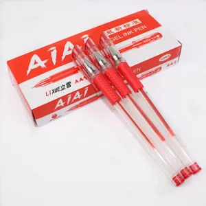 Gros plan d'un stylo gel rouge montrant une pointe fine et un corps lisse pour l'ecriture.