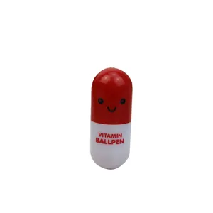 Cute smiley face capsule-shaped retractable ballpoint pen in red and white for students