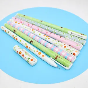 Close-up detail of cute cartoon black ink pens featuring floral and deer patterns for students.