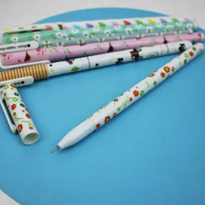 Detail view of cute cartoon gel pens showing floral patterns and fine writing tip