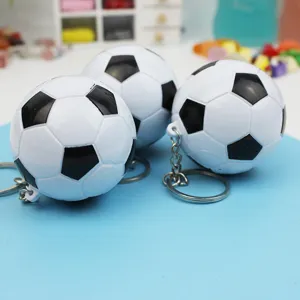 Miniature football shaped ballpoint pen keychain, portable cute design for everyday carry.